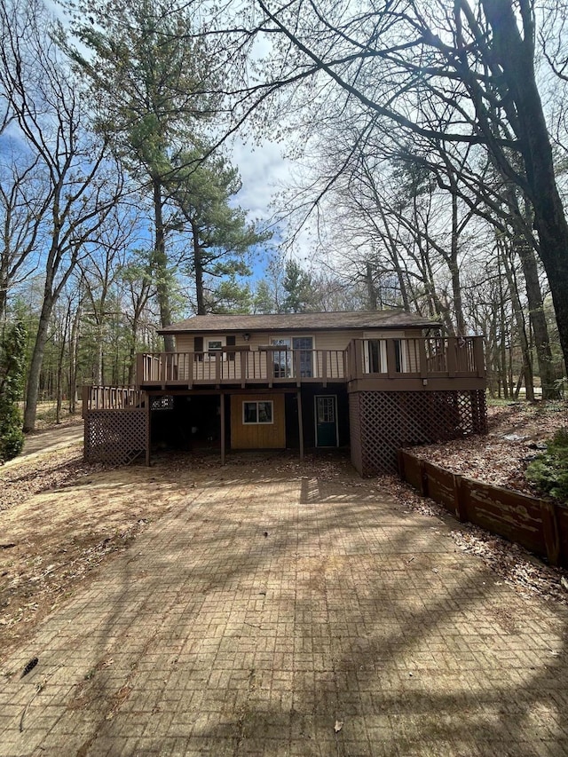 757 E Sidney Rd, Stanton, MI 48888 - rear view of property with a deck