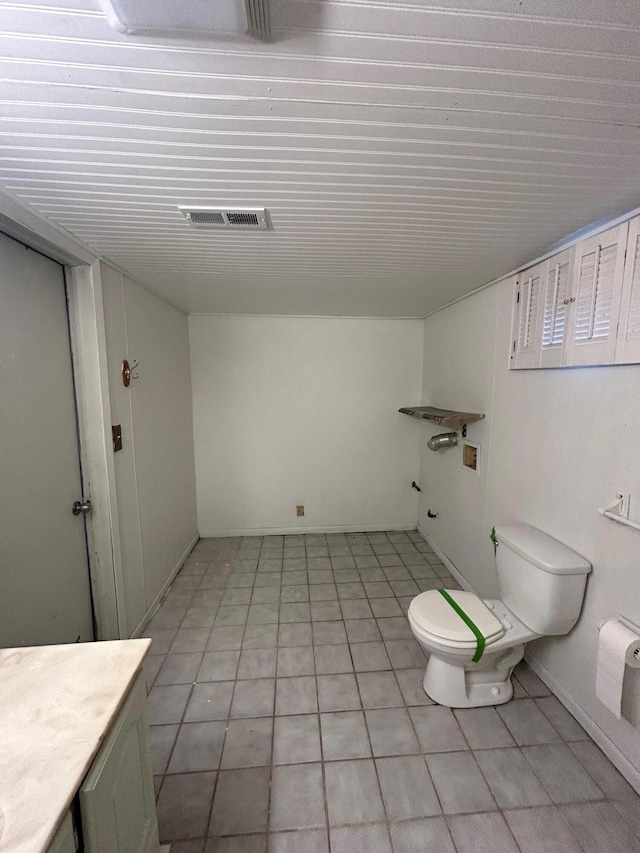 757 E Sidney Rd, Stanton, MI 48888 - bathroom with baseboards, tile patterned flooring, toilet, and visible vents