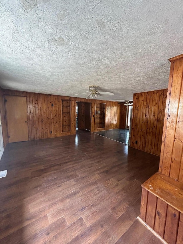 757 E Sidney Rd, Stanton, MI 48888 - interior space with a textured ceiling, ceiling fan, and wood finished floors