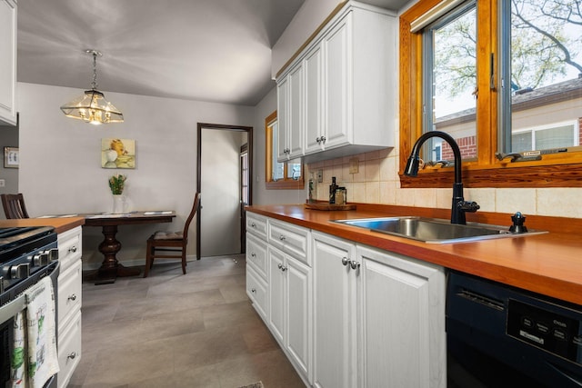 kitchen featuring a sink, range with gas cooktop, black dishwasher, and white cabinetry