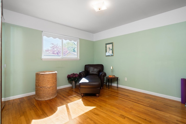sitting room featuring light wood-style floors and baseboards