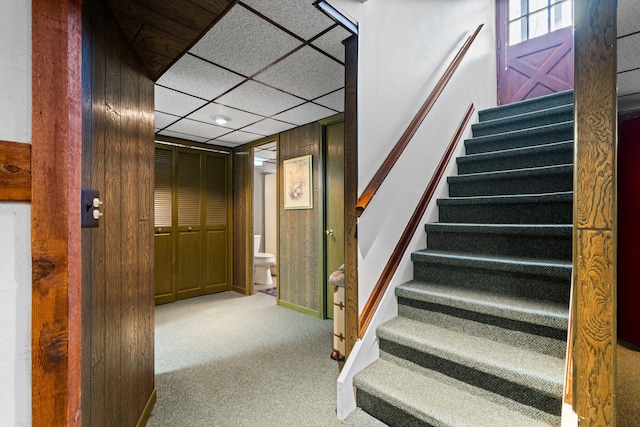 stairway with carpet flooring and baseboards