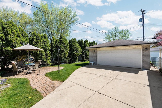 detached garage featuring fence