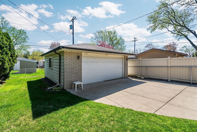 detached garage featuring fence