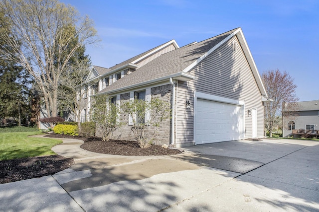 view of home's exterior featuring a garage, roof with shingles, and concrete driveway