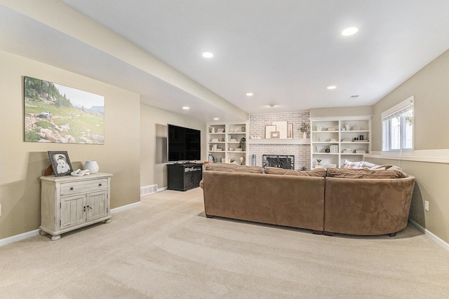 living area with baseboards, recessed lighting, a brick fireplace, and light colored carpet