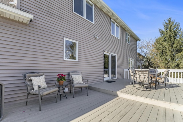 wooden deck with outdoor dining space