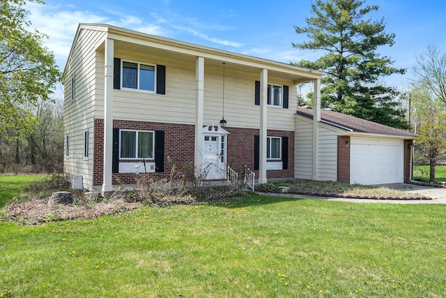 view of front of home with brick siding, a garage, and a front lawn