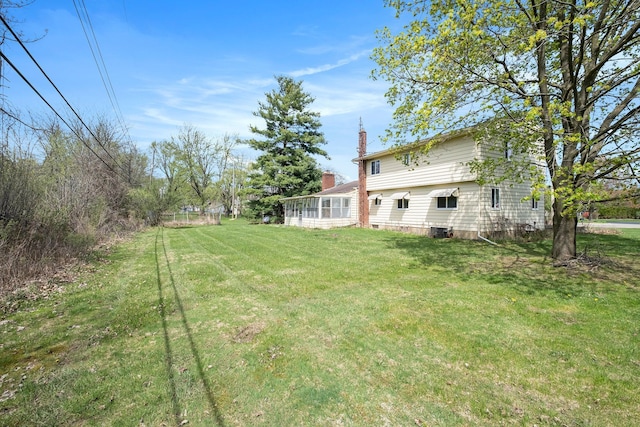 view of yard with central AC