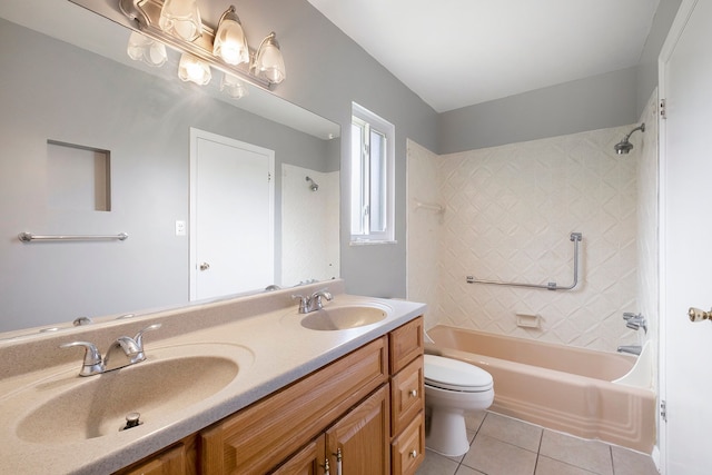 full bath featuring toilet, tile patterned floors, a sink, and bathtub / shower combination