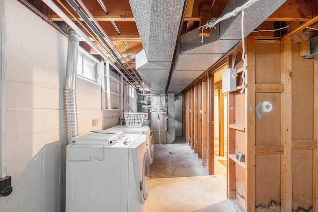 unfinished below grade area with water heater and independent washer and dryer
