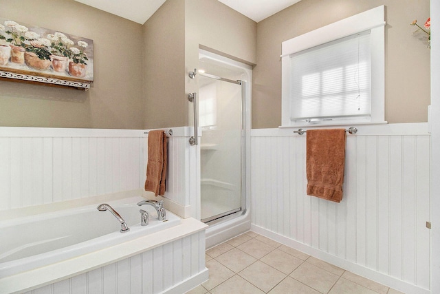 8 Georgia Ct, Pentwater, MI 49449 - full bathroom with wainscoting, tile patterned floors, a shower stall, and a bath