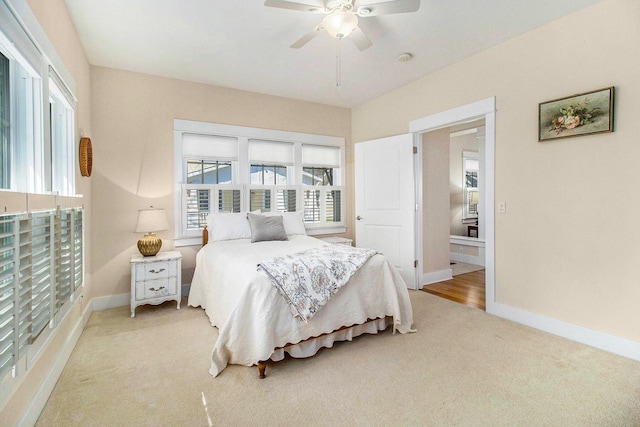 8 Georgia Ct, Pentwater, MI 49449 - bedroom with baseboards, ceiling fan, and light carpet