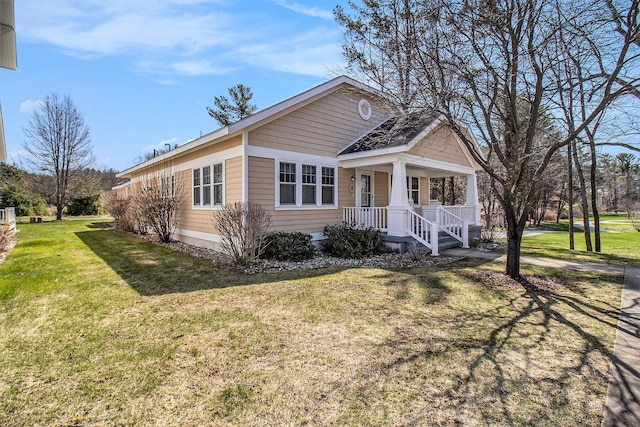 8 Georgia Ct, Pentwater, MI 49449 - view of front of property with a porch and a front yard