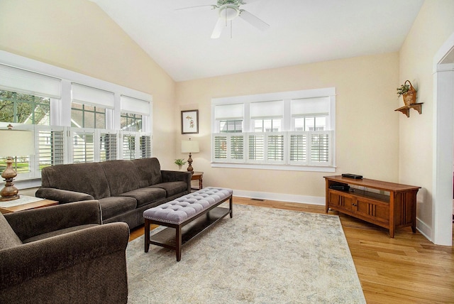 8 Georgia Ct, Pentwater, MI 49449 - living room with light wood-style floors, a ceiling fan, baseboards, lofted ceiling, and visible vents
