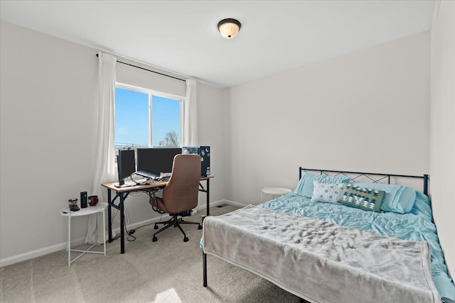 bedroom featuring carpet floors and baseboards