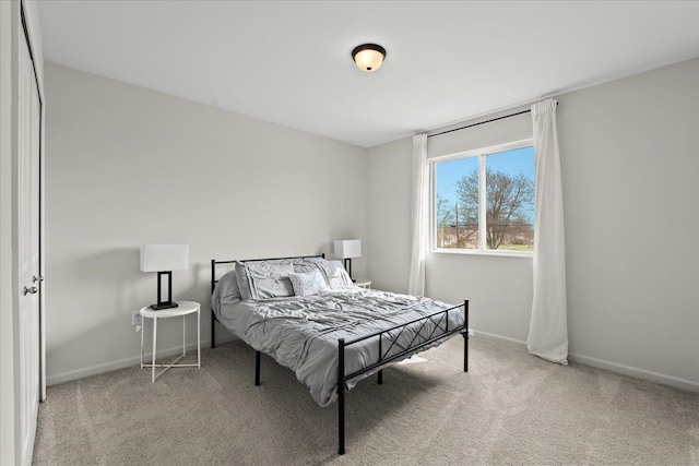 carpeted bedroom with baseboards