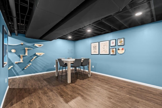 dining room featuring baseboards and wood finished floors