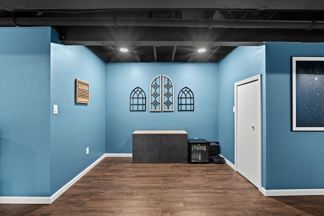 interior space with recessed lighting, baseboards, and wood finished floors