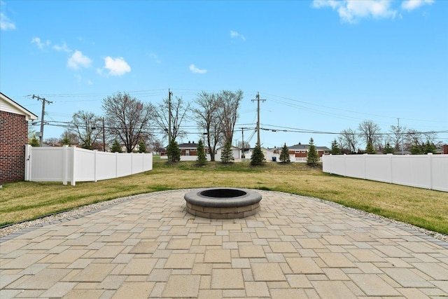 view of patio / terrace featuring fence and an outdoor fire pit