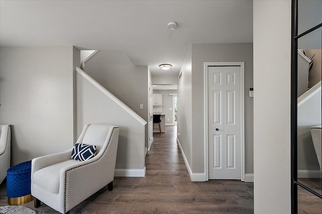interior space with baseboards, wood finished floors, and visible vents