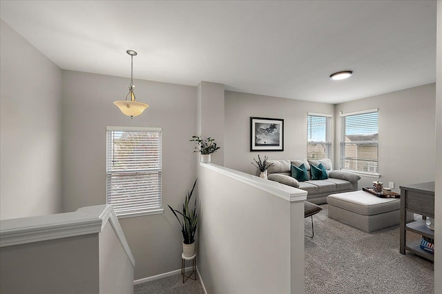 living room with baseboards and carpet flooring