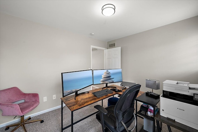 office space featuring baseboards, carpet, and visible vents