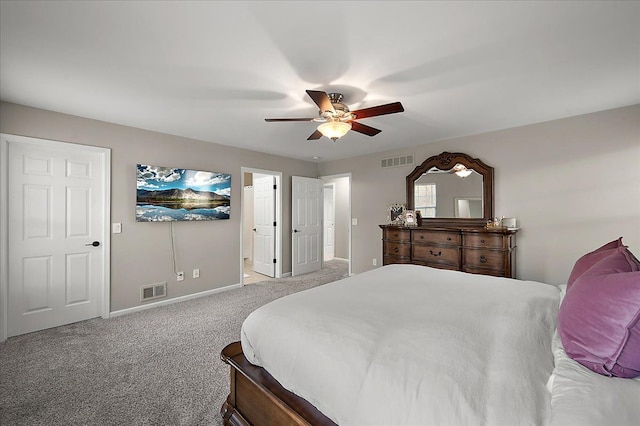 carpeted bedroom with baseboards, visible vents, and ceiling fan