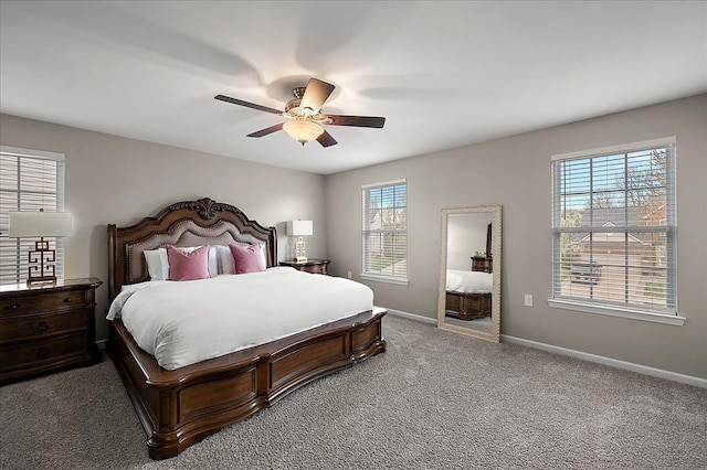 carpeted bedroom with baseboards and a ceiling fan