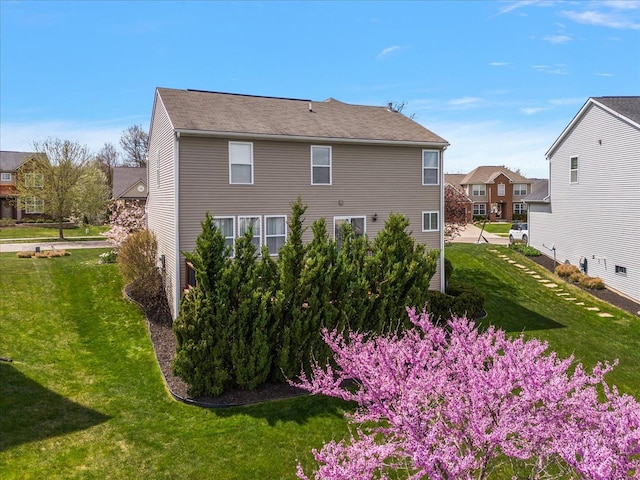 view of side of property with a yard