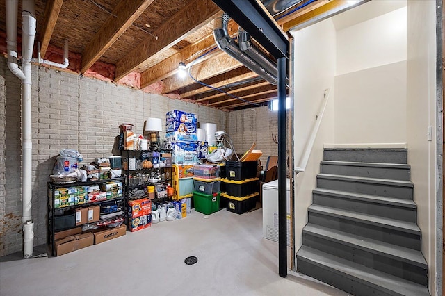 unfinished basement featuring stairs