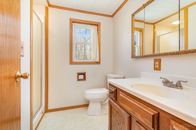 bathroom featuring vanity, toilet, baseboards, a shower stall, and ornamental molding