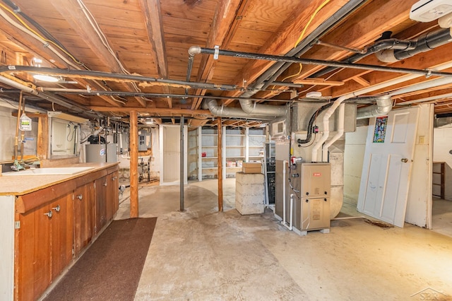 unfinished basement with heating unit and gas water heater