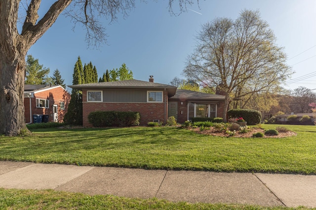 single story home with central air condition unit, brick siding, a chimney, and a front yard