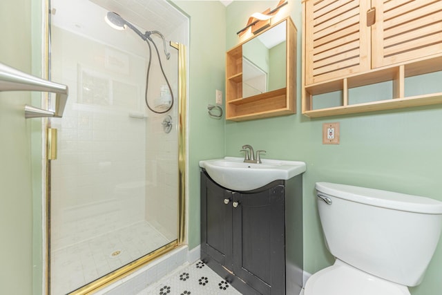 full bath with vanity, toilet, tile patterned flooring, and a stall shower