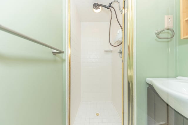 full bath with tile patterned floors and a stall shower