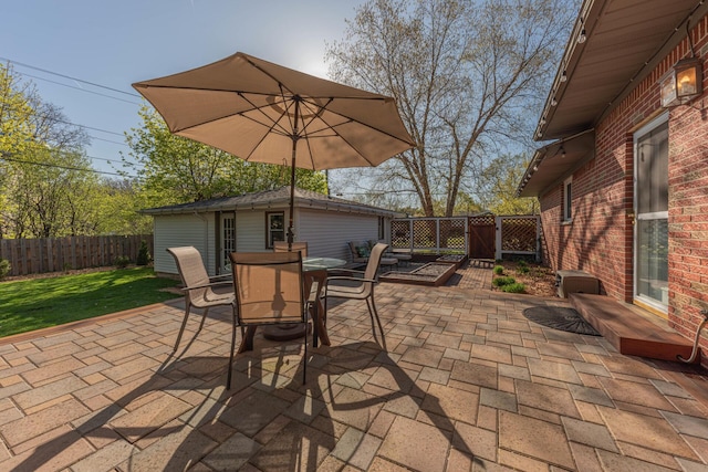 view of patio with a fenced backyard and outdoor dining space
