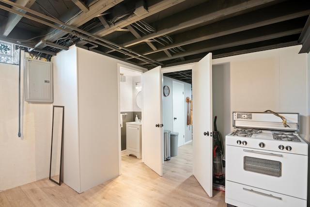 below grade area featuring light wood-style floors and electric panel