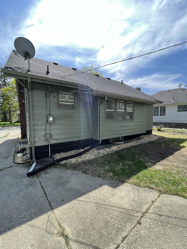 rear view of property with fence
