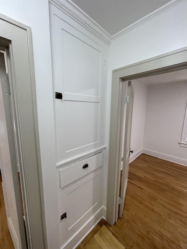 2314 Begole St, Flint, MI 48504 - detailed view of crown molding, wood finished floors, and baseboards