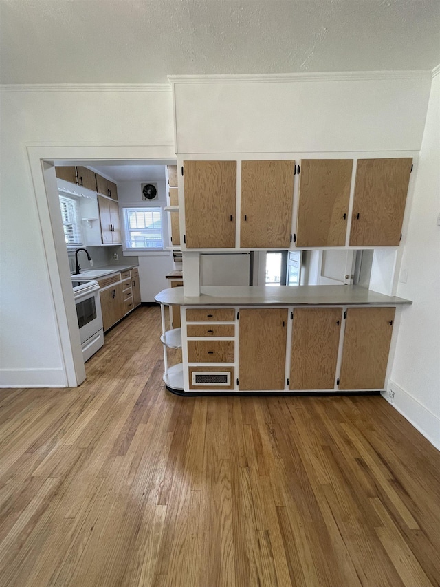 kitchen with crown molding, open shelves, light wood finished floors, and white electric range oven