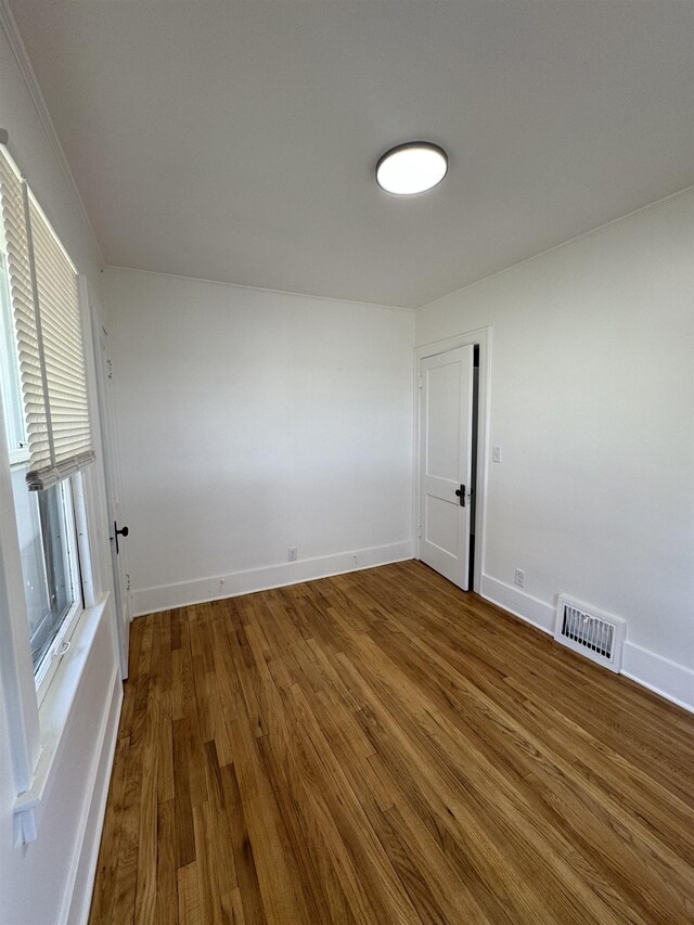 2314 Begole St, Flint, MI 48504 - unfurnished room with wood finished floors and baseboards