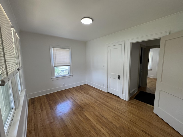 2314 Begole St, Flint, MI 48504 - unfurnished bedroom featuring wood finished floors and baseboards