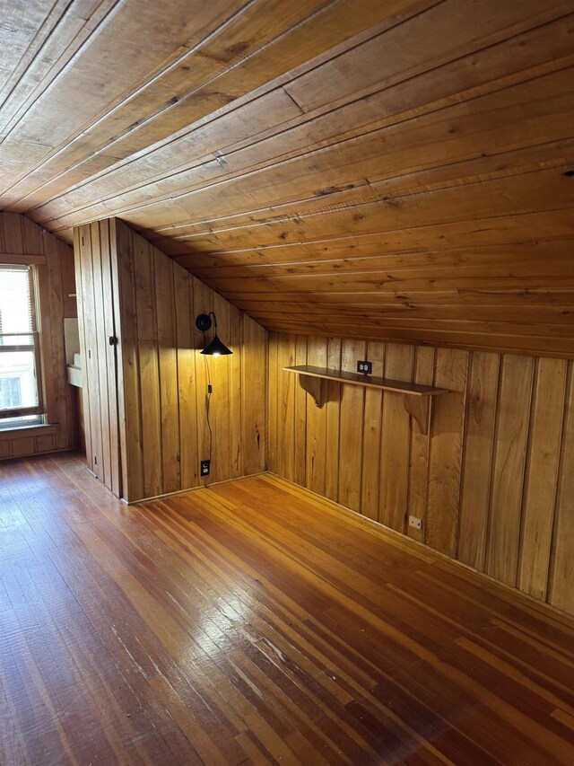 2314 Begole St, Flint, MI 48504 - additional living space with wooden ceiling, hardwood / wood-style flooring, wood walls, and vaulted ceiling