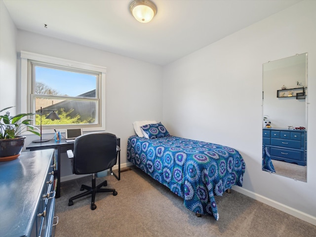 bedroom with baseboards and carpet flooring