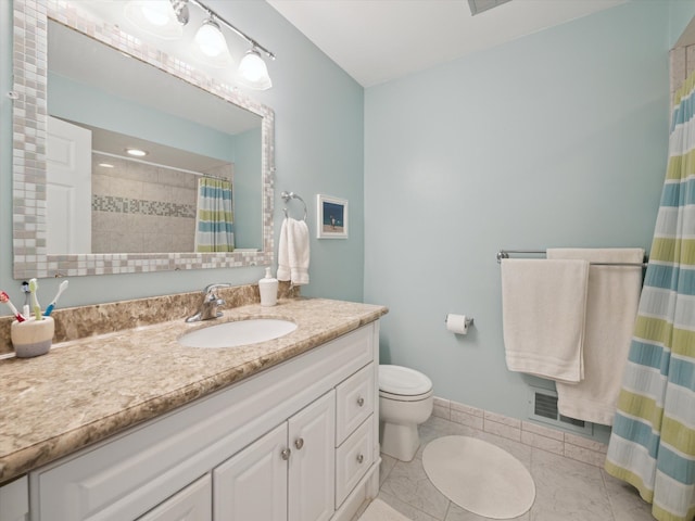 full bath featuring visible vents, vanity, baseboards, tile patterned floors, and toilet