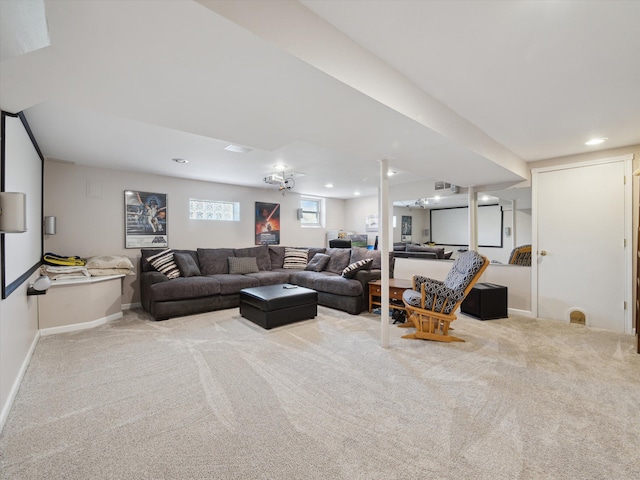 carpeted living room featuring baseboards and recessed lighting