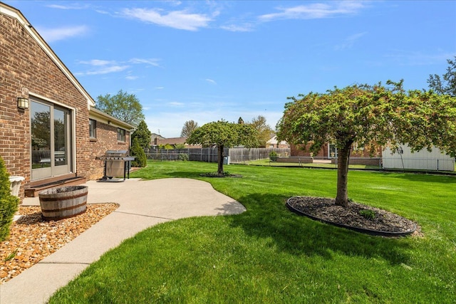 view of yard with a patio and fence