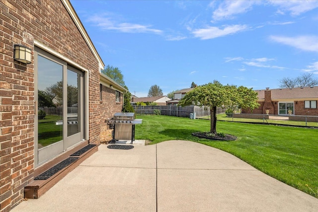 view of patio with grilling area and fence