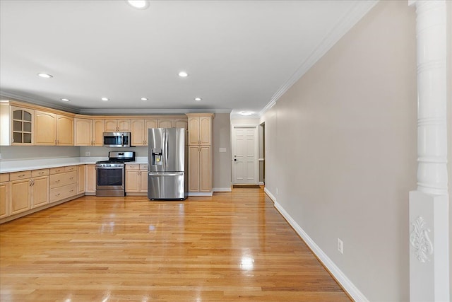 kitchen with crown molding, light brown cabinetry, appliances with stainless steel finishes, baseboards, and glass insert cabinets
